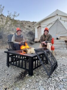 Enjoying a campfire with friends at Vegas Glamping